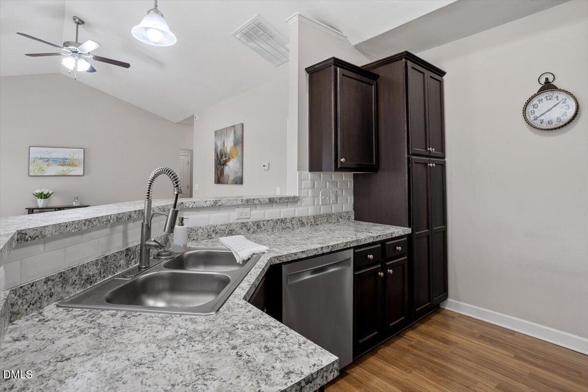 35 Fox Run Court Benson, NC 27504 - Photo 15 of 54 a kitchen with stainless steel appliances granite countertop a sink stove and refrigerator