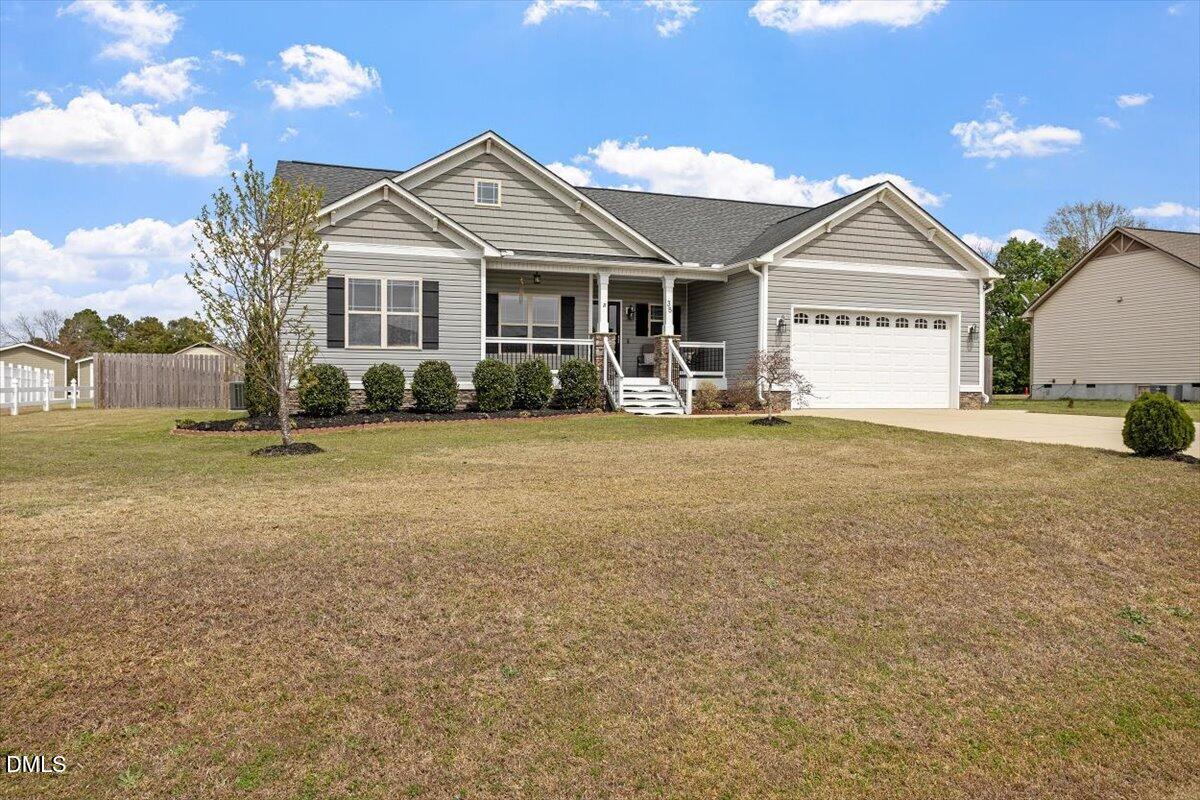 35 Fox Run Court Benson, NC 27504 - Photo 26 of 54 a front view of a house with a yard