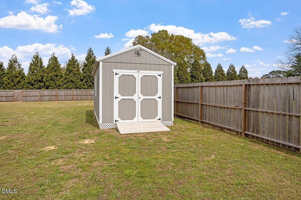 35 Fox Run Court Benson, NC 27504 - Photo 29 of 54 a view of a yard with wooden fence