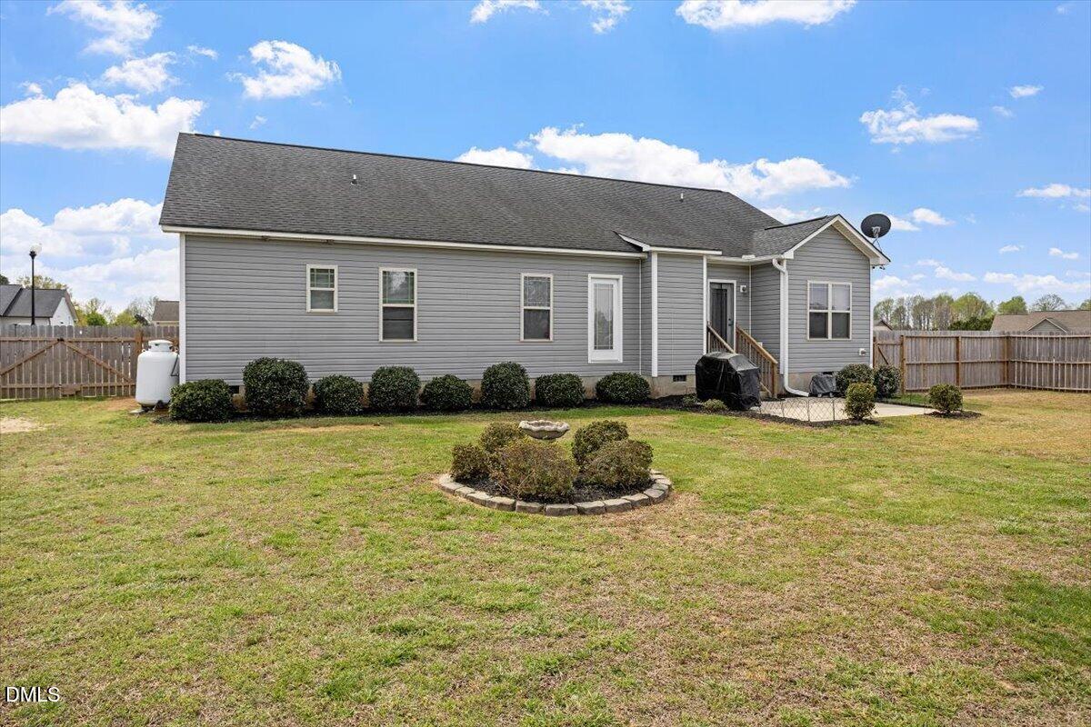 35 Fox Run Court Benson, NC 27504 - Photo 31 of 54 a front view of a house with a yard