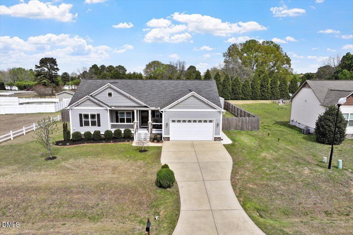 35 Fox Run Court Benson, NC 27504 - Photo 32 of 54 a front view of a house with a yard