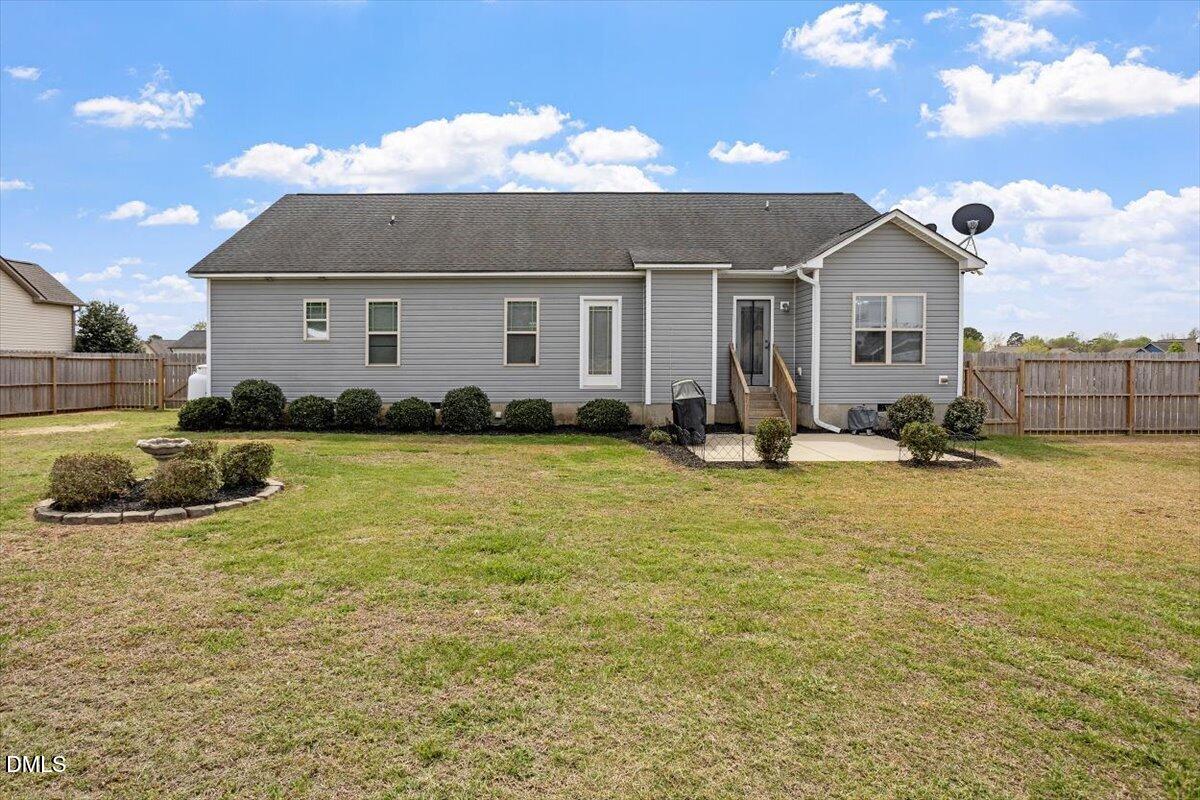 35 Fox Run Court Benson, NC 27504 - Photo 33 of 54 a view of a house with backyard
