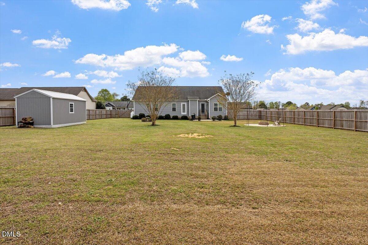 35 Fox Run Court Benson, NC 27504 - Photo 37 of 54 a view of a large pool with table and chairs