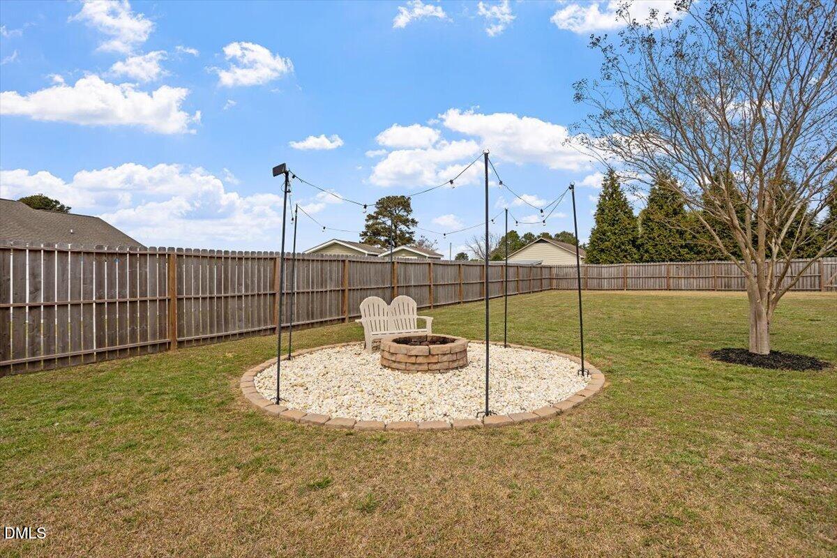35 Fox Run Court Benson, NC 27504 - Photo 39 of 54 a view of a swimming pool with a yard