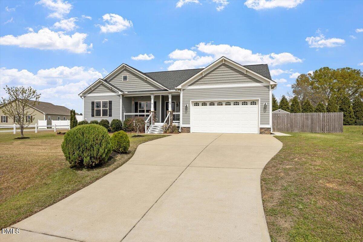 35 Fox Run Court Benson, NC 27504 - Photo 54 of 54 a front view of a house with a yard and garage