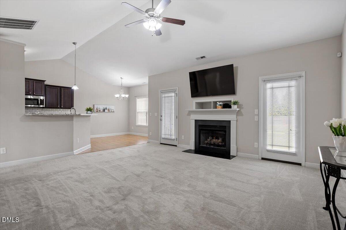 35 Fox Run Court Benson, NC 27504 - Photo 8 of 54 a view of a livingroom with a fireplace a window and a fireplace