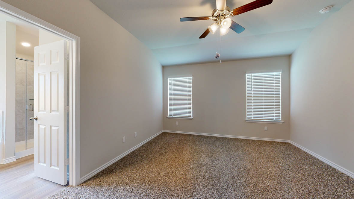 405 Creekfall Road Burnet, TX 78611 - Photo 12 of 27 a view of room with window and ceiling fan