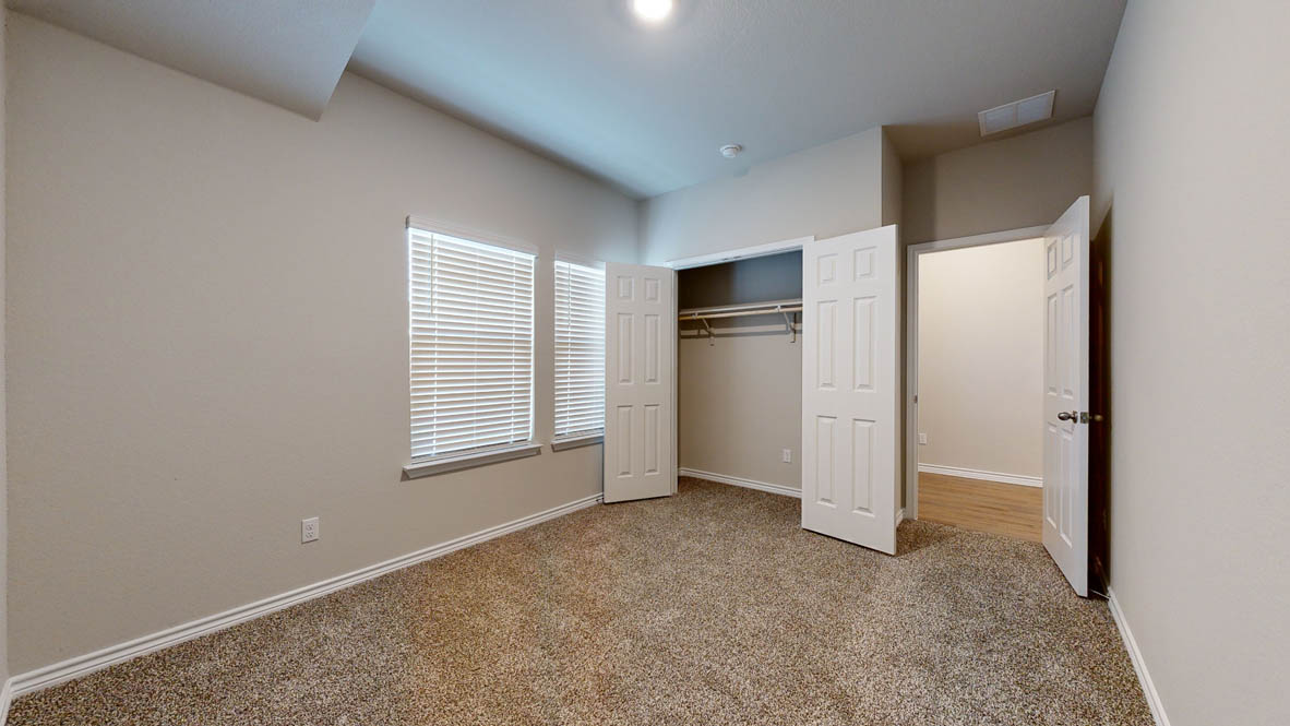 405 Creekfall Road Burnet, TX 78611 - Photo 23 of 27 a view of an empty room with a window