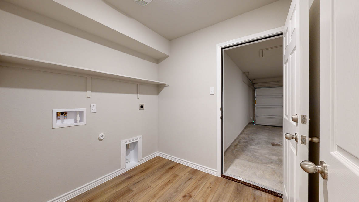 405 Creekfall Road Burnet, TX 78611 - Photo 6 of 27 a view of a hallway with wooden floor