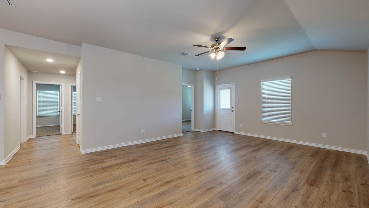 405 Creekfall Road Burnet, TX 78611 - Photo 8 of 27 wooden floor in an empty room with a window