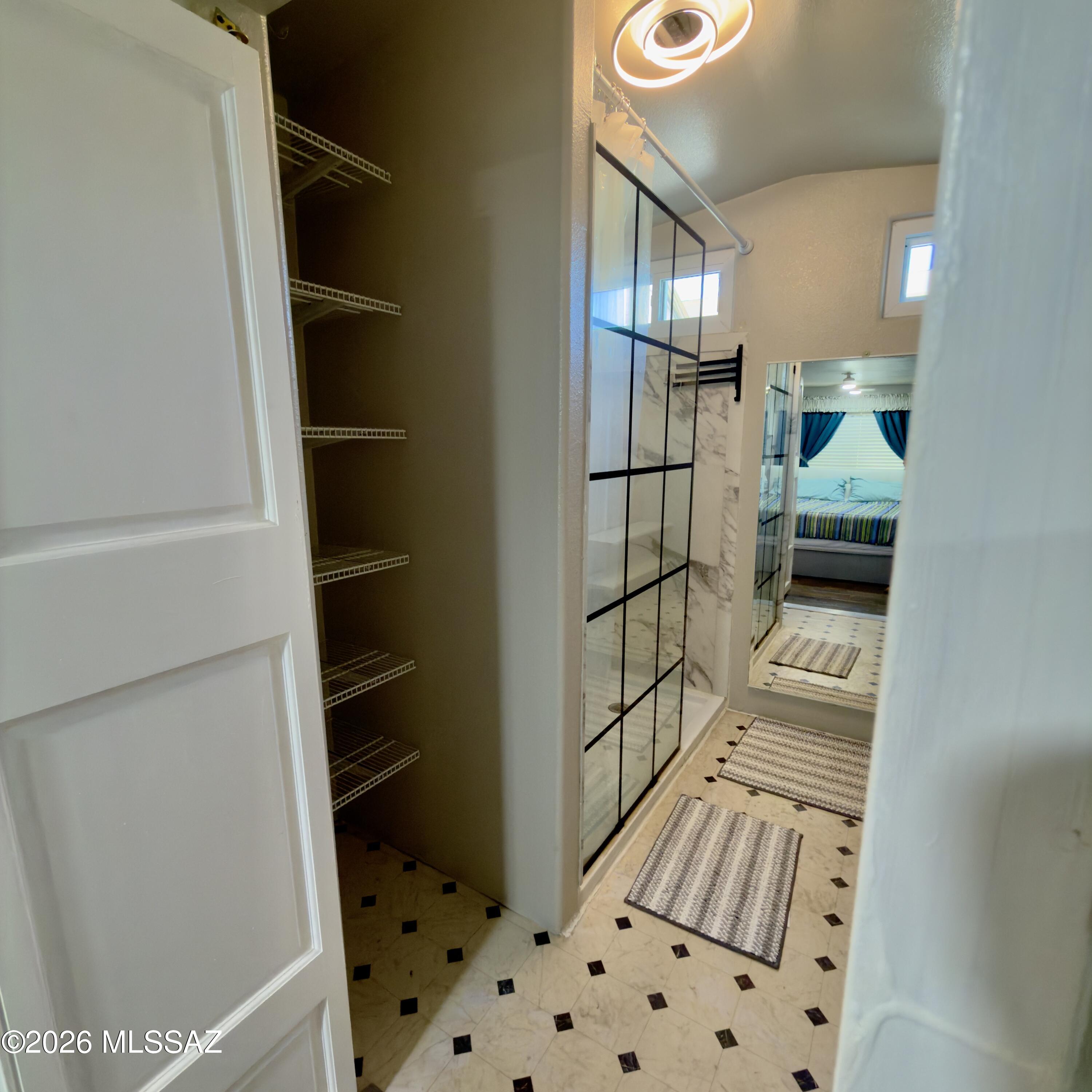 2843 19 Interstate 19 Frontage Road, Unit 116 Amado, AZ 85645 - Photo 18 of 32 a view of walk in closet and bedroom
