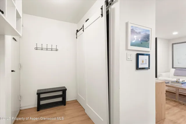 a view of a hallway with workspace and entryway