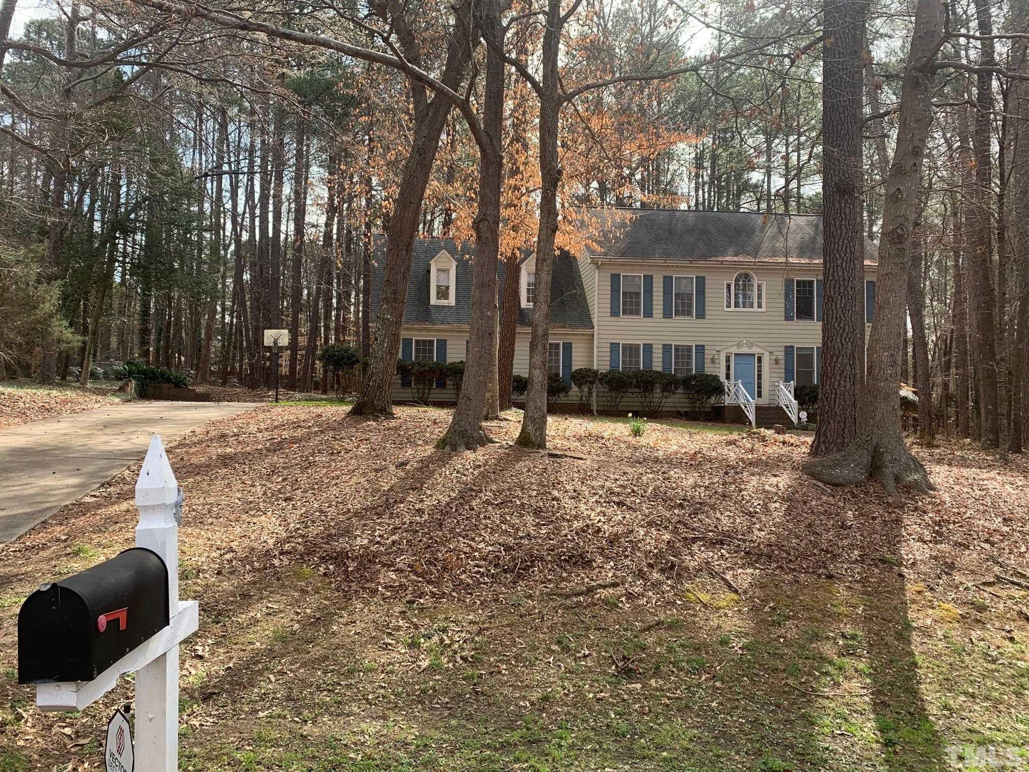 4013 Country Village Drive Raleigh, NC 27606 - Photo 1 of 23 a view of a house with a yard covered in snow