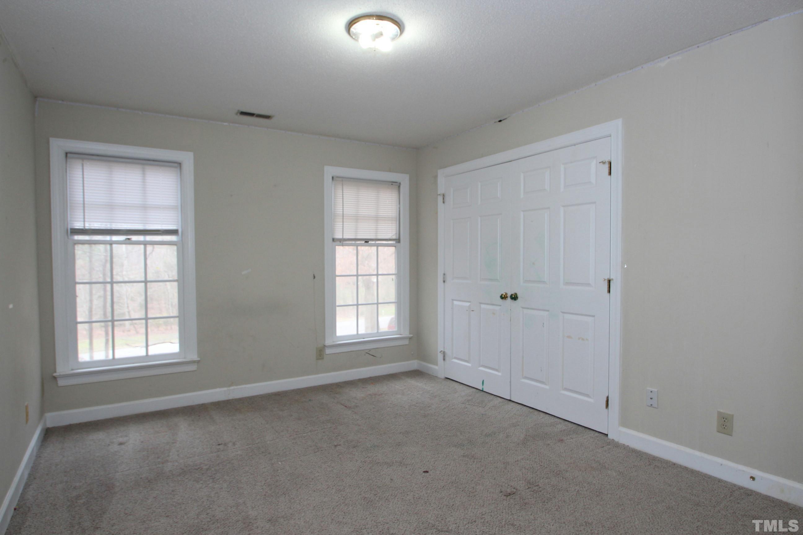 4013 Country Village Drive Raleigh, NC 27606 - Photo 17 of 23 an empty room with windows