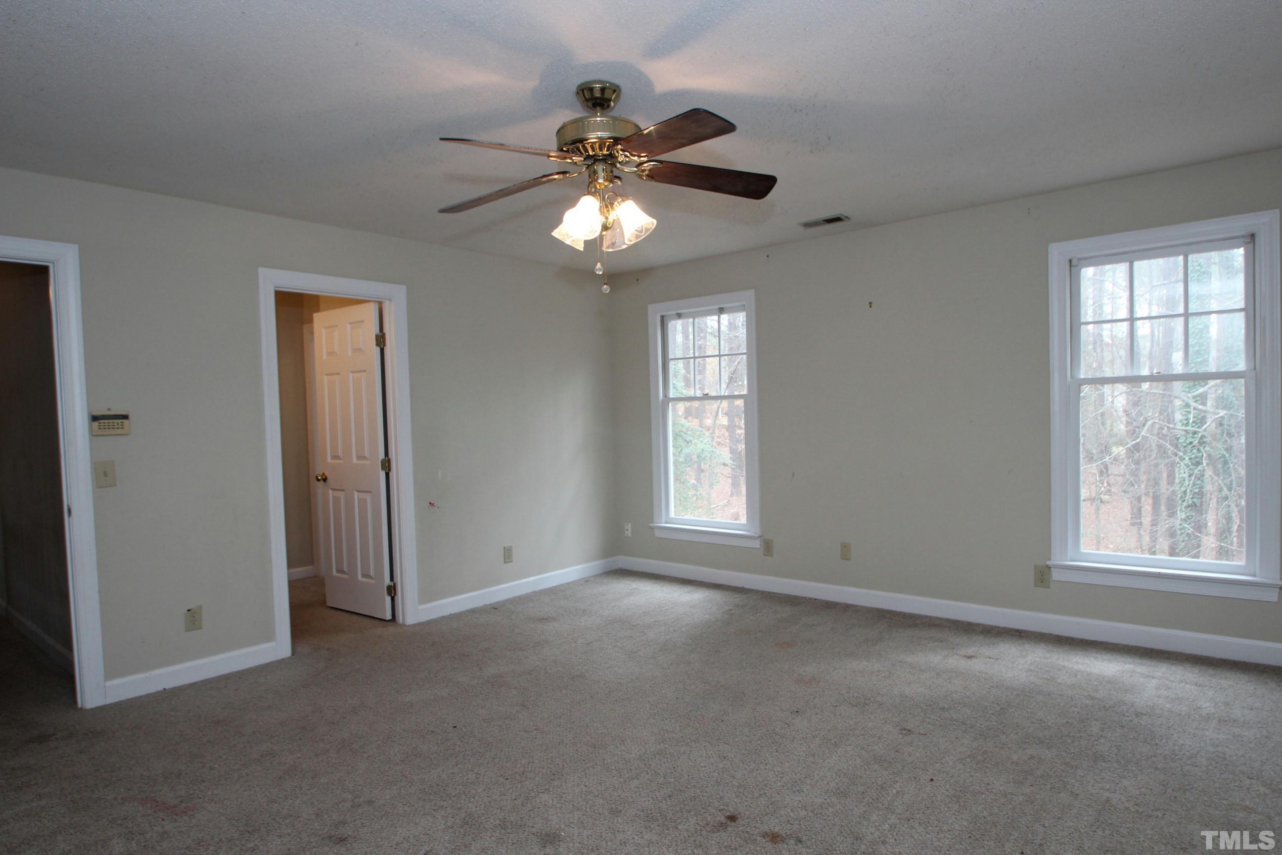 4013 Country Village Drive Raleigh, NC 27606 - Photo 19 of 23 a view of an empty room with a window