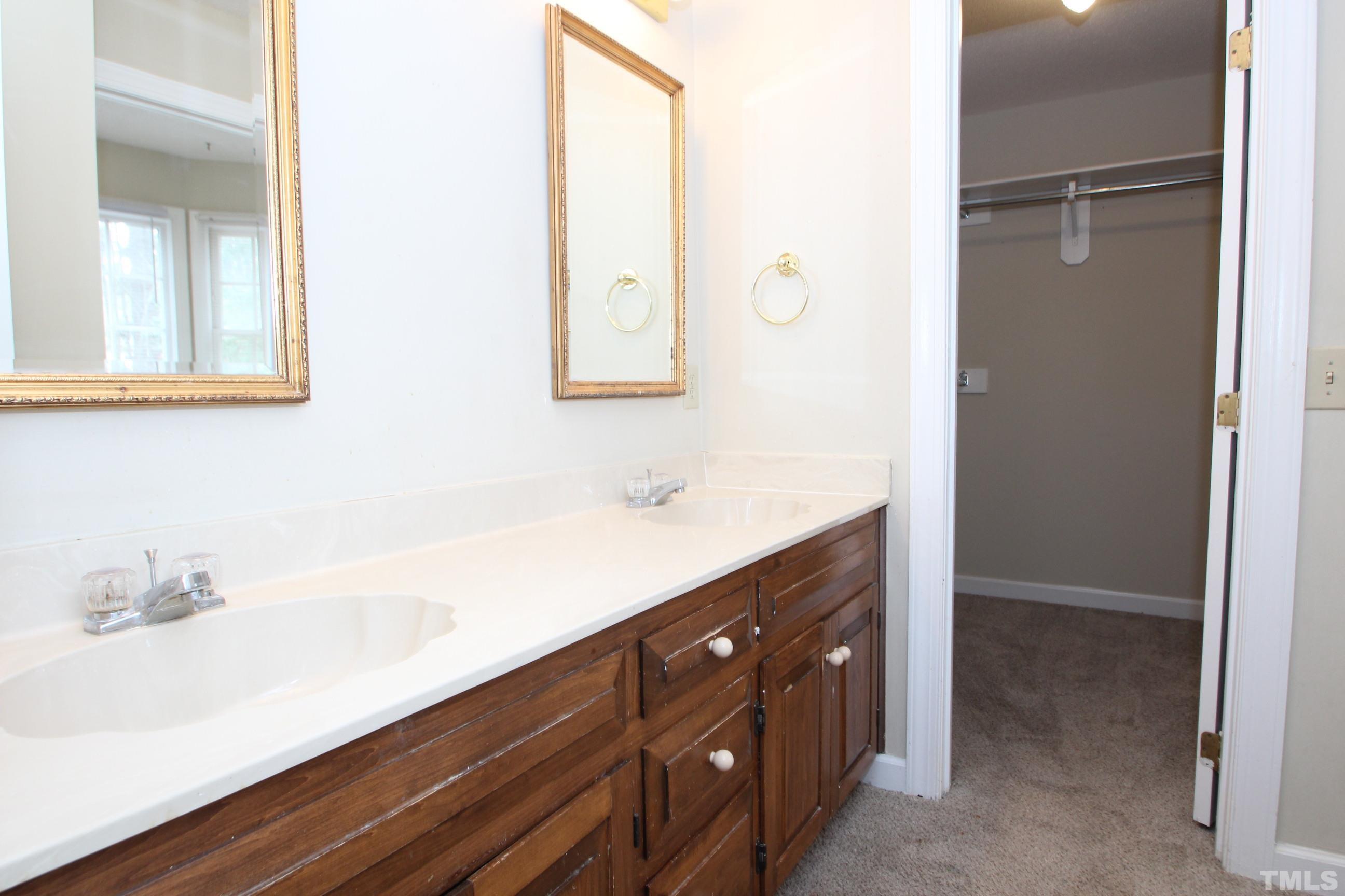 4013 Country Village Drive Raleigh, NC 27606 - Photo 20 of 23 a bathroom with a sink and a mirror