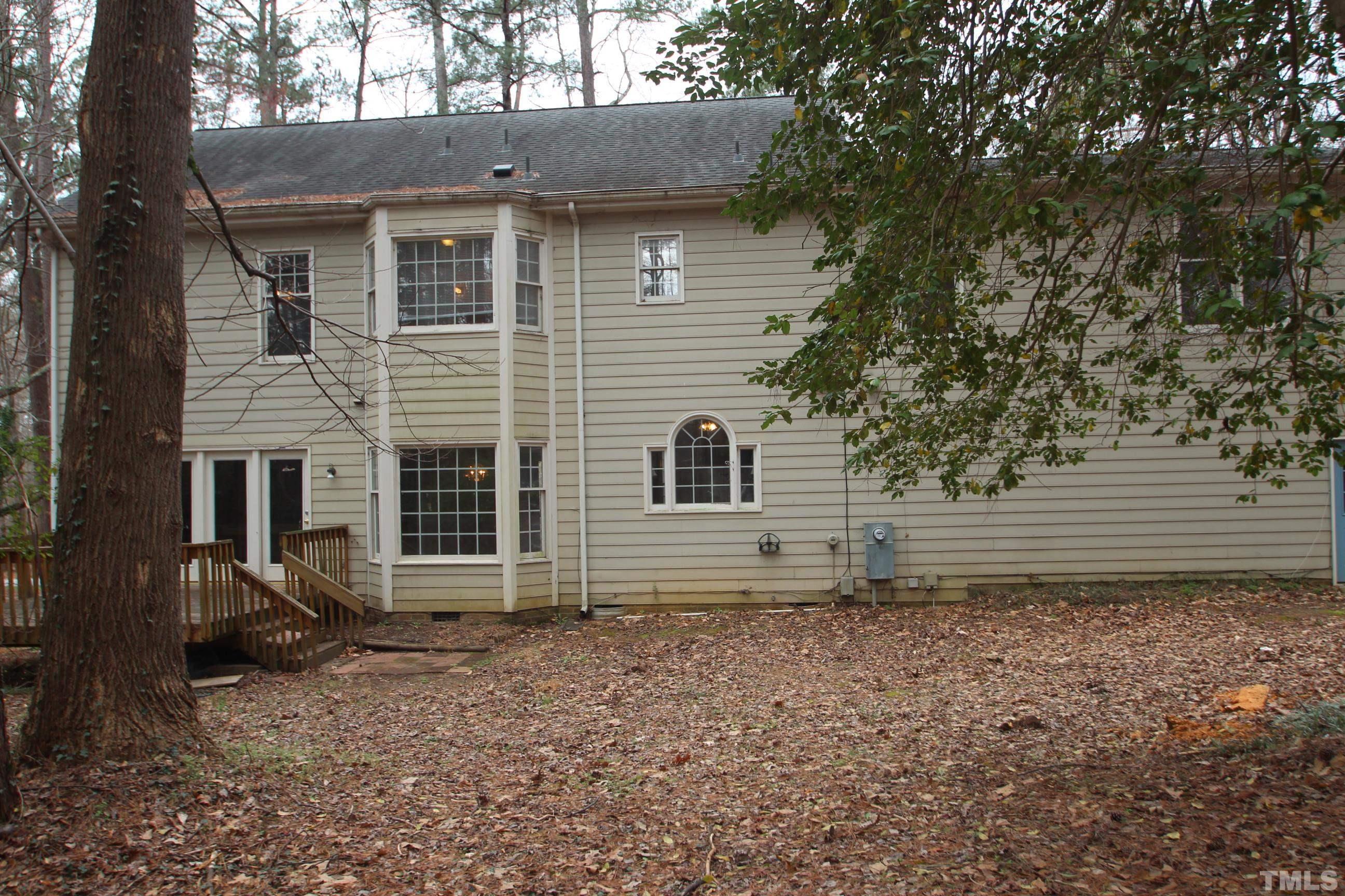4013 Country Village Drive Raleigh, NC 27606 - Photo 5 of 23 a view of a house with a yard