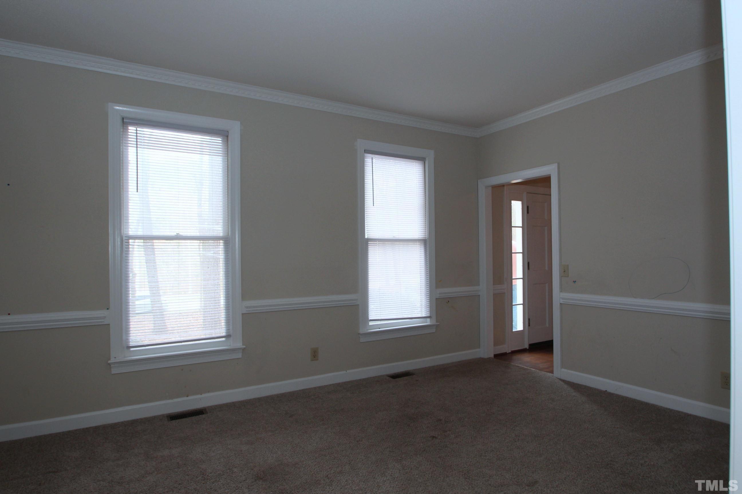 4013 Country Village Drive Raleigh, NC 27606 - Photo 10 of 23 an empty room with windows