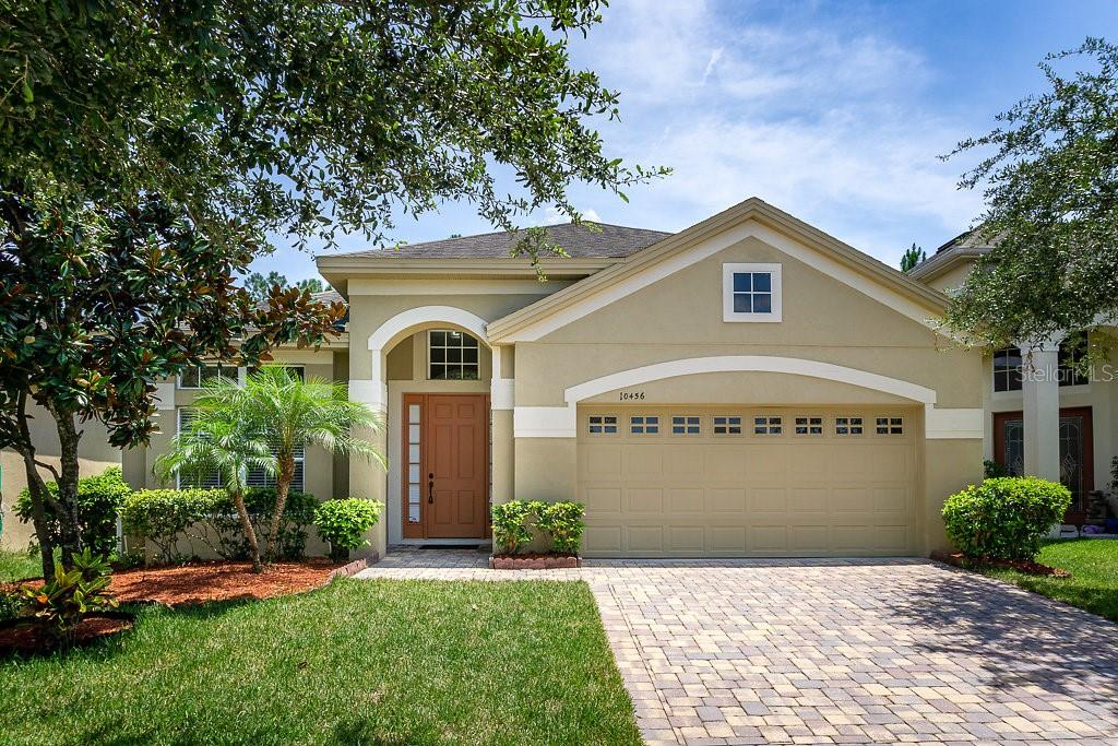 10456 Willow Ridge Loop Orlando, FL 32825 - Photo 1 of 1 a view of front of house with a yard