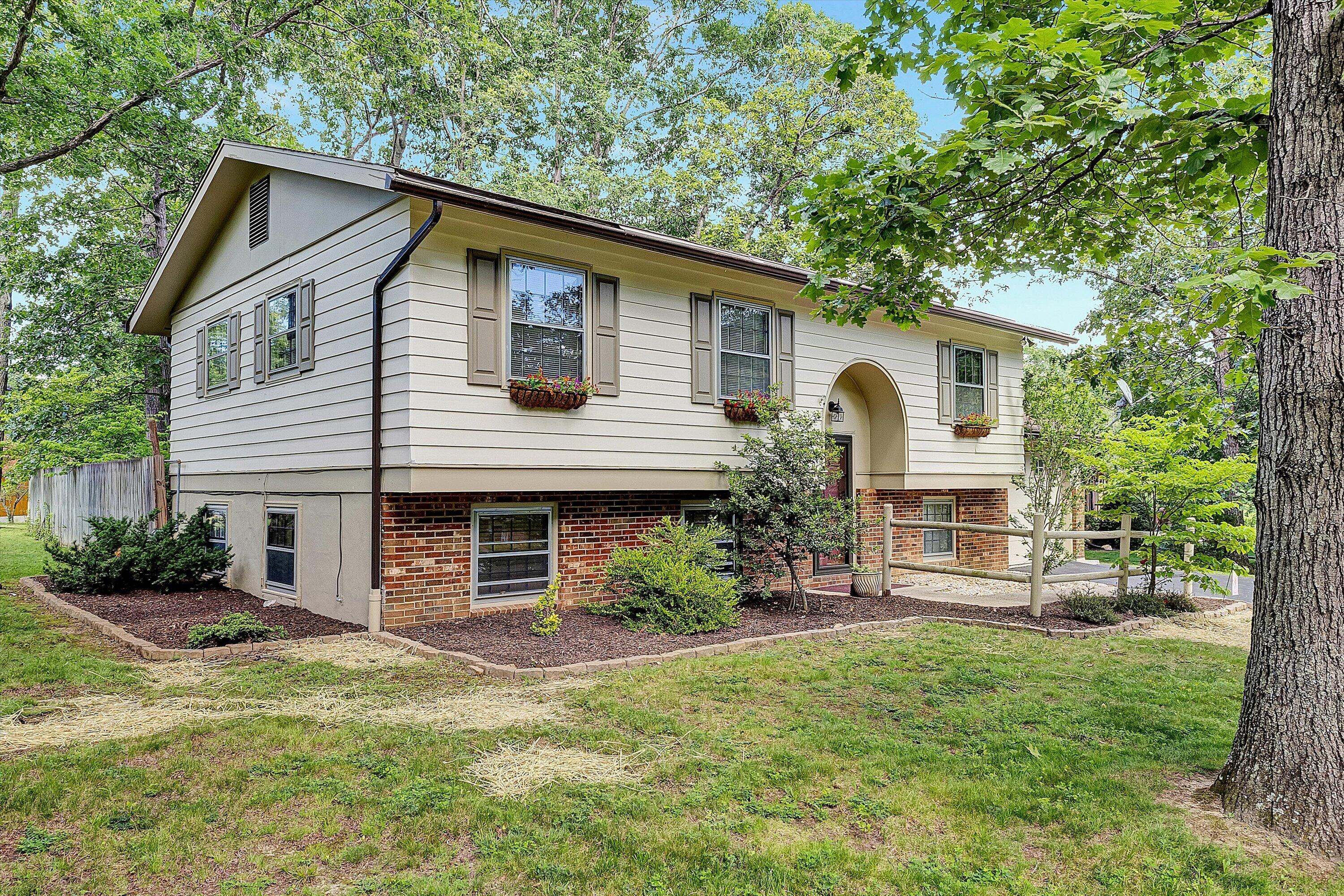 912 Cherokee Trail Covington, VA 24426 - Photo 24 of 31 a front view of a house with garden