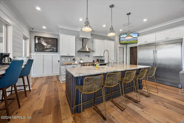 a kitchen with stainless steel appliances granite countertop a sink and stove