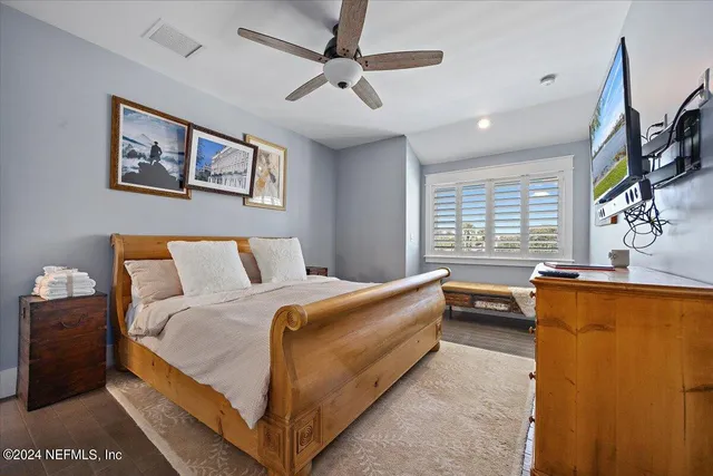 a bedroom with furniture and windows