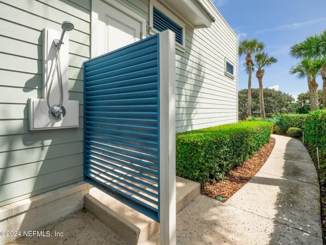 a view of roof deck with chair and wooden floor