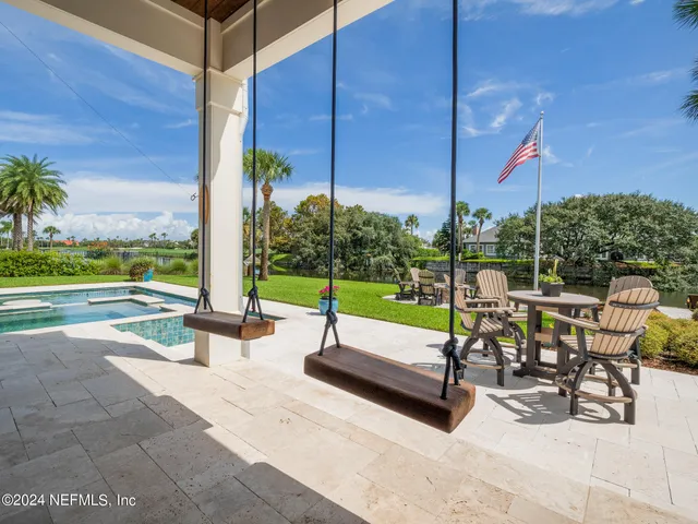 a view of roof deck with chairs