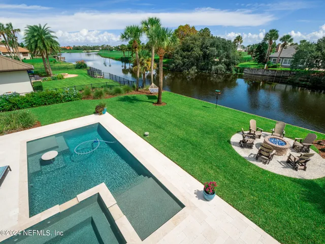 a view of swimming pool with a patio