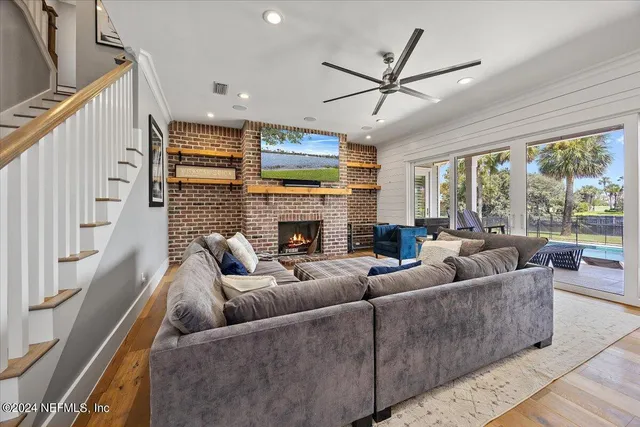a dining room with furniture a rug and a chandelier