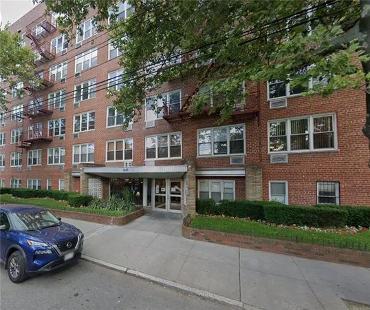 a front view of a building with street view