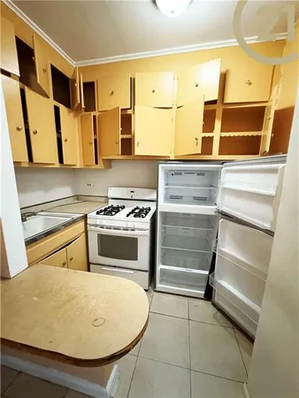 a kitchen with stainless steel appliances granite countertop a stove and a microwave