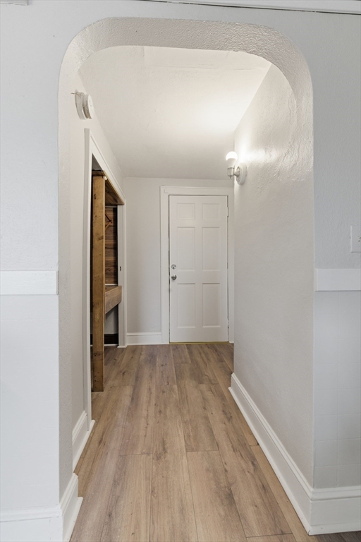 293 Clemente Street, Unit 3R Holyoke, MA 01040 - Photo 4 of 14 a view of empty room with wooden floor