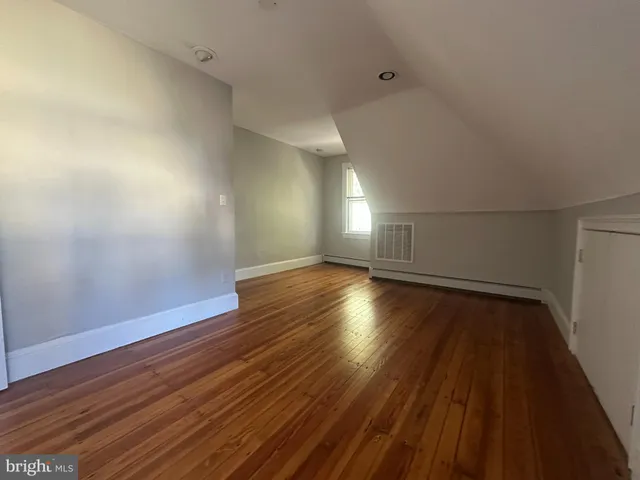 a view of a room with wooden floors and led lights