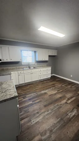 a large kitchen with cabinets