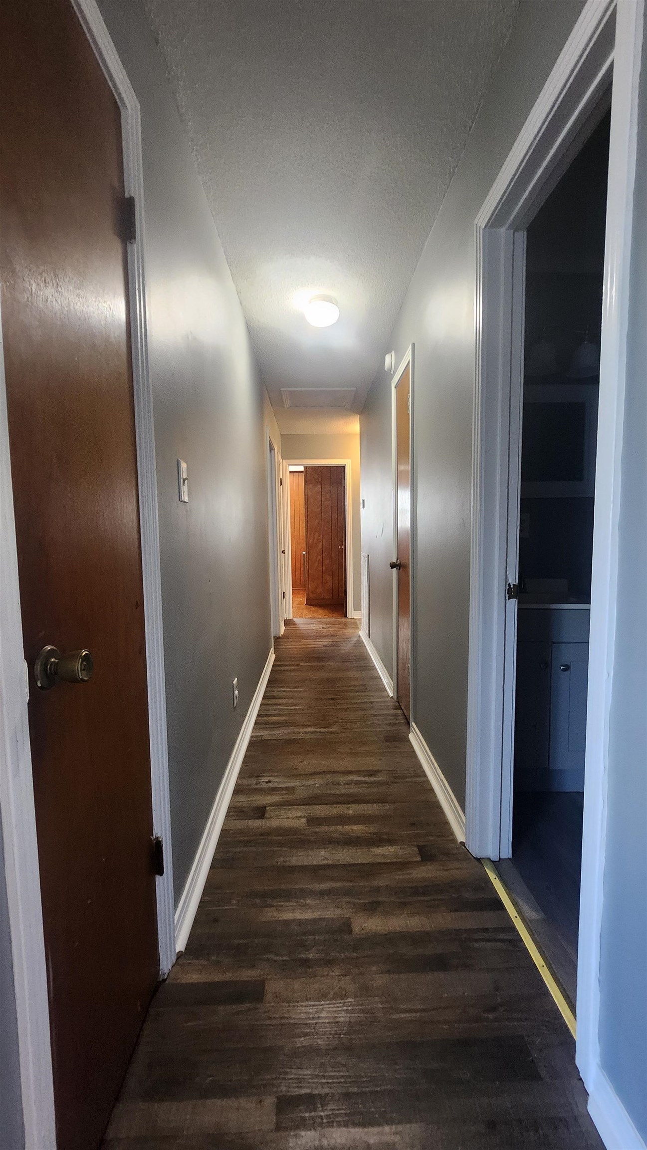 56 Riddick Street Gates, TN 38037 - Photo 6 of 10 a view of a hallway with wooden floor