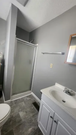 a bathroom with a sink and toilet