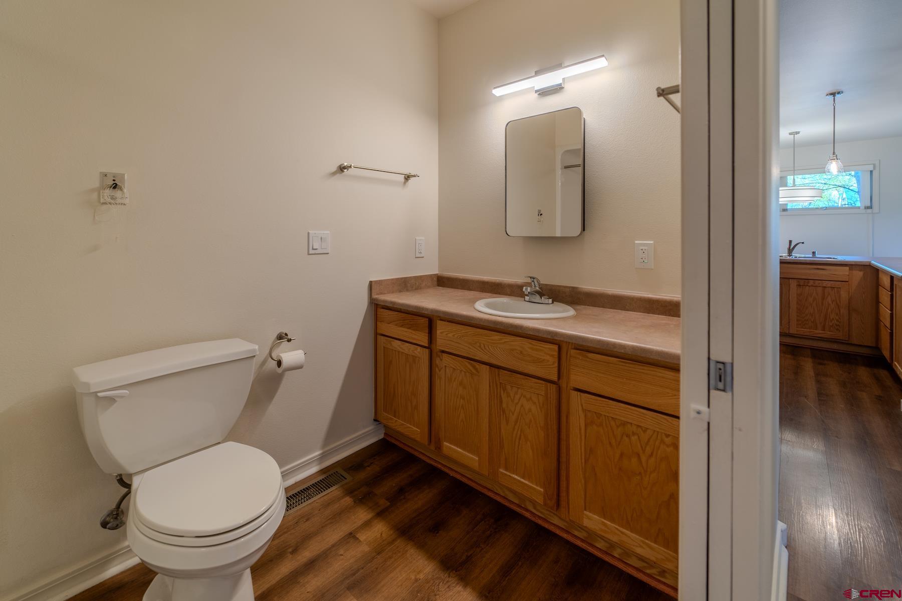 35 Sunshine Court, Unit 3 Durango, CO 81301 - Photo 11 of 26 a bathroom with a toilet sink and mirror