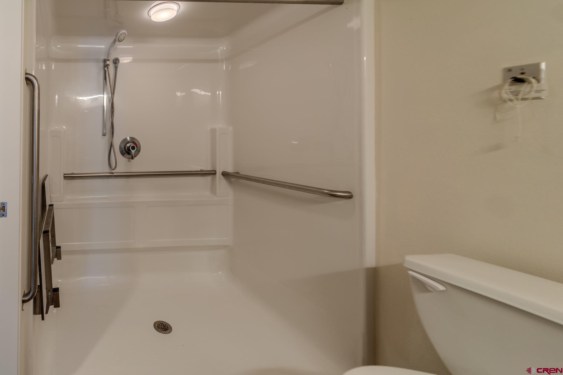 35 Sunshine Court, Unit 3 Durango, CO 81301 - Photo 13 of 26 a bathroom with a shower and a toilet