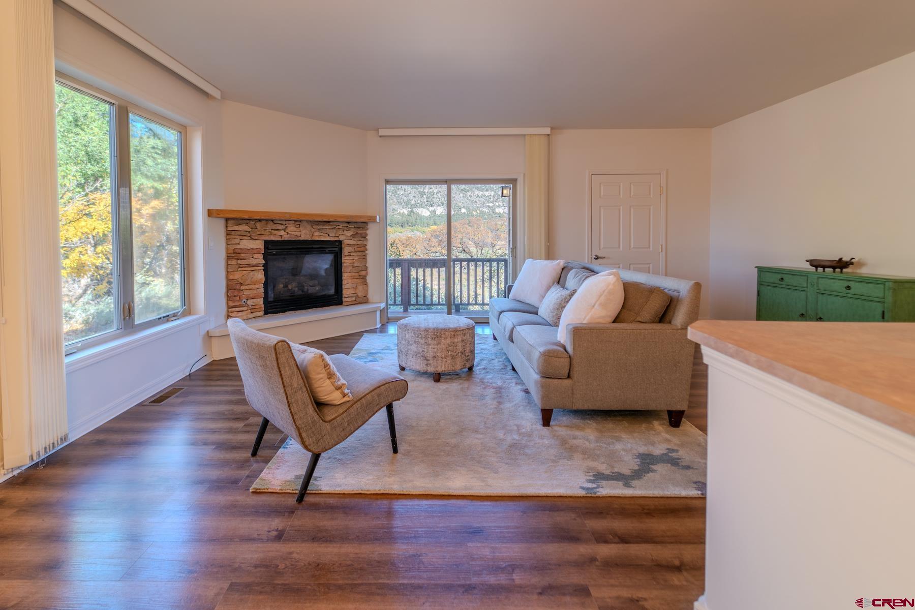 35 Sunshine Court, Unit 3 Durango, CO 81301 - Photo 2 of 26 a living room with furniture and a fireplace
