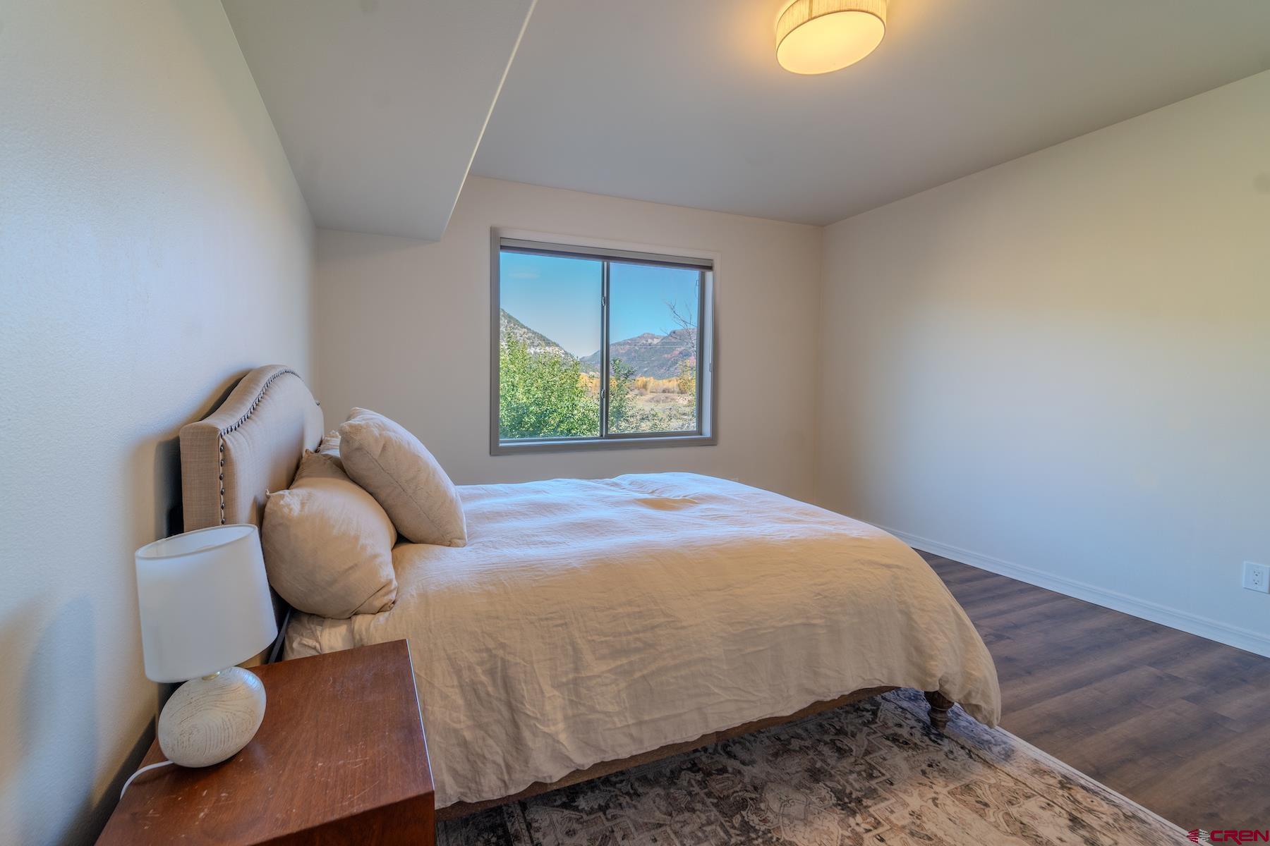 35 Sunshine Court, Unit 3 Durango, CO 81301 - Photo 24 of 26 a bedroom with a bed and window