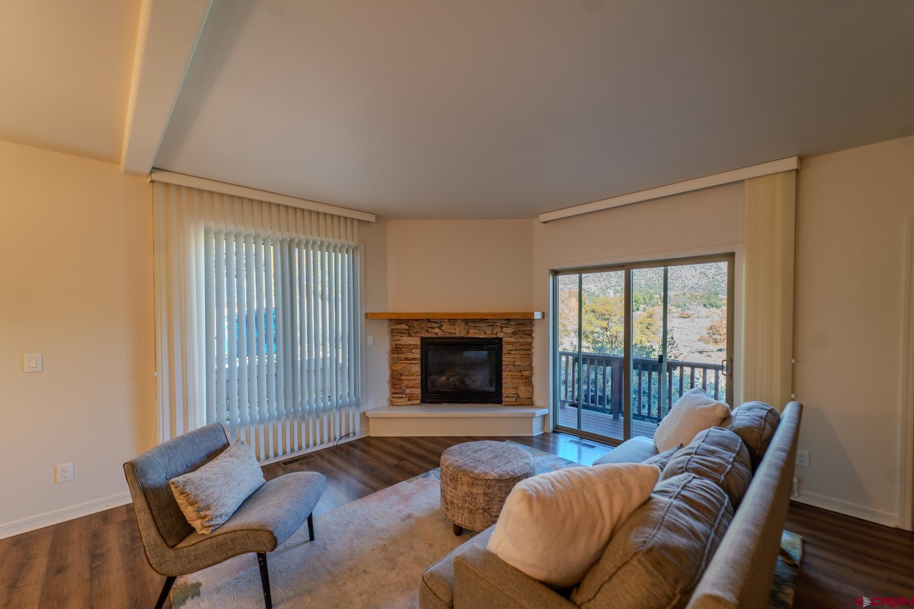 35 Sunshine Court, Unit 3 Durango, CO 81301 - Photo 3 of 26 a living room with furniture and a fireplace
