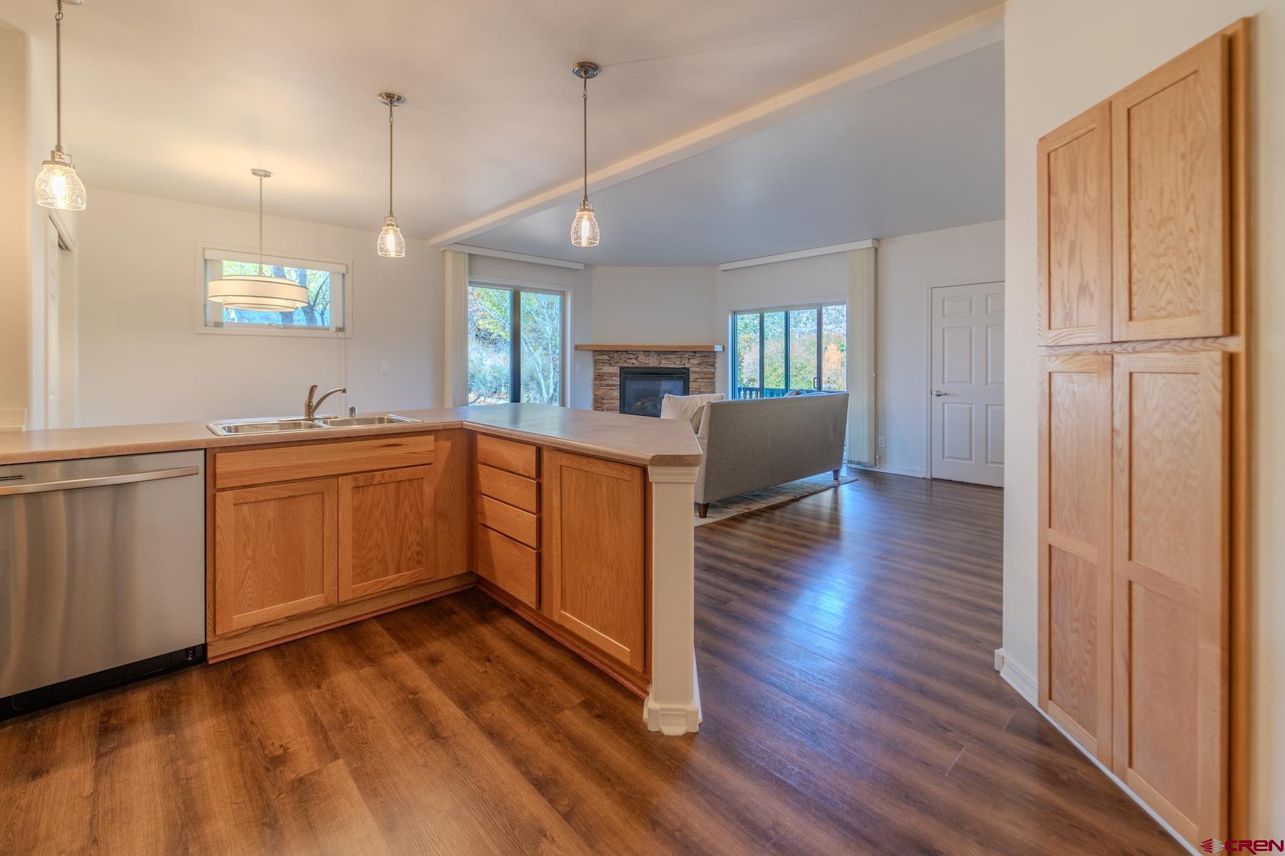 35 Sunshine Court, Unit 3 Durango, CO 81301 - Photo 6 of 26 a view of a kitchen with a sink cabinets and wooden floor