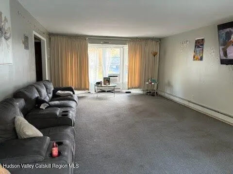 a room with gym equipment and a large window