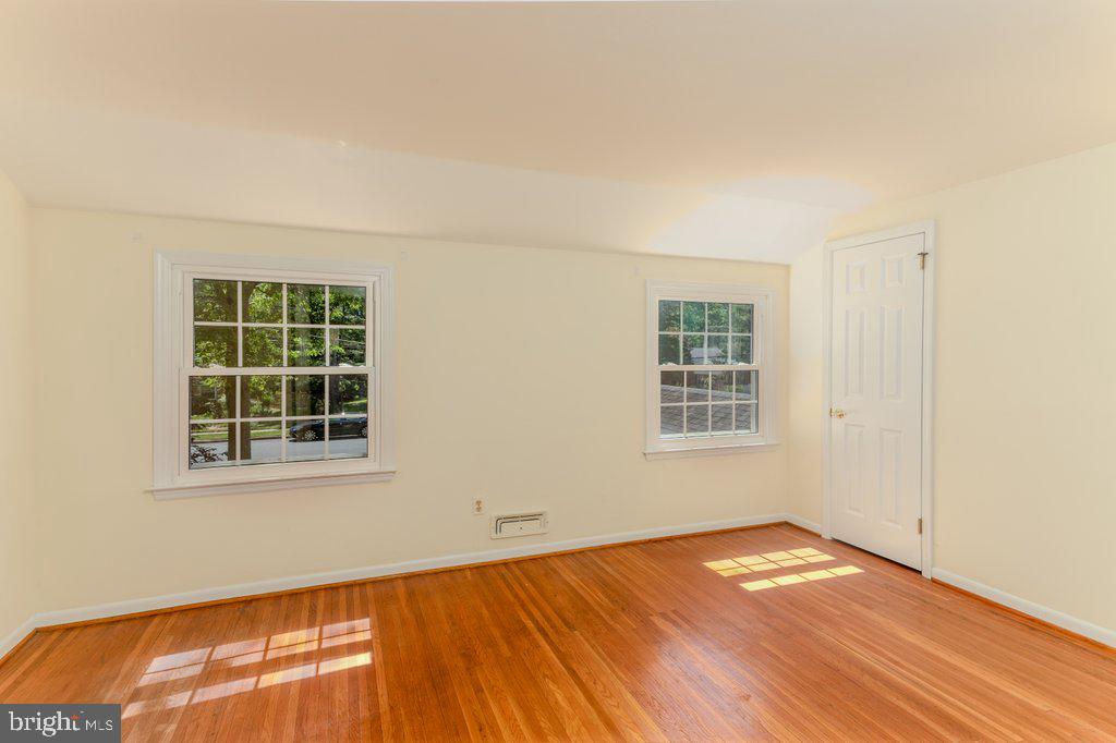 324 Wayland Road Cherry Hill, NJ 08034 - Photo 22 of 28 an empty room with wooden floor and windows