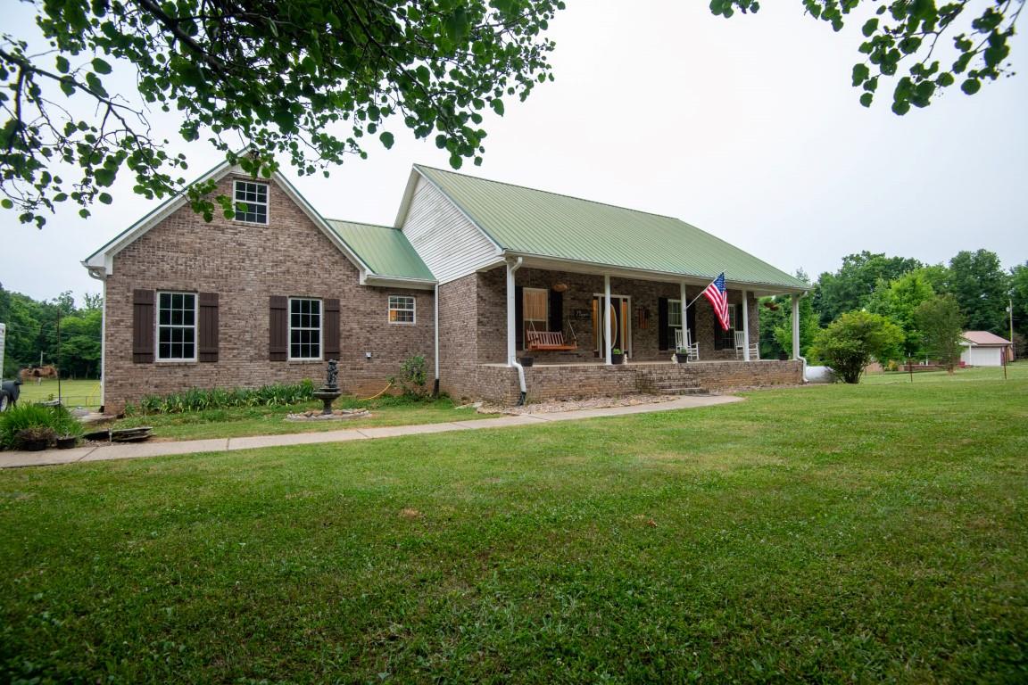 631 Belfast Farmington Road Belfast, TN 37019 - Photo 1 of 30 Welcome to 631 Belfast Farmington Road... Secluded setting with 9+acres, mature trees, basement, shop, front and back porches and so much more..