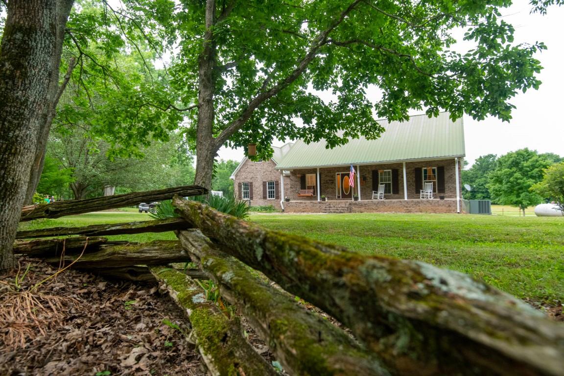 631 Belfast Farmington Road Belfast, TN 37019 - Photo 2 of 30 The drive meanders thru the woods and opens up to the house site.. The driveway is shared