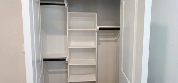 a view of an empty walk in closet