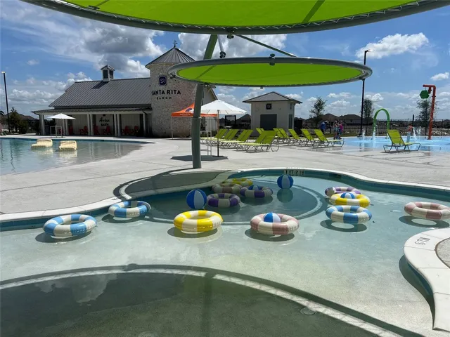 a room with lots of residential furniture and shower