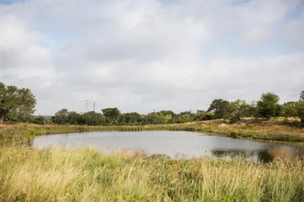 a view of a lake with houses in the background
